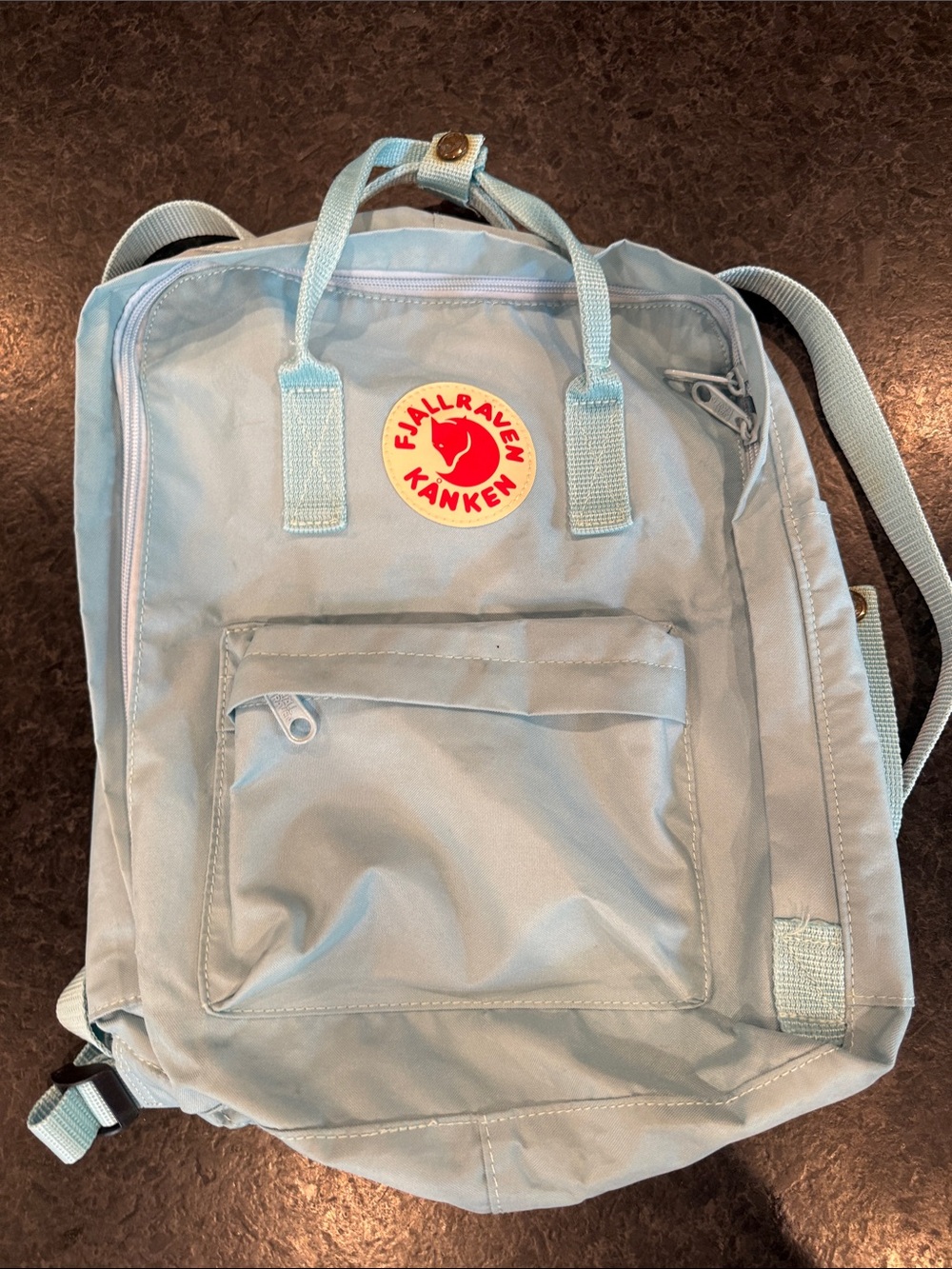 Fjallraven Kånken Backpack in Light Blue with Red Round Logo